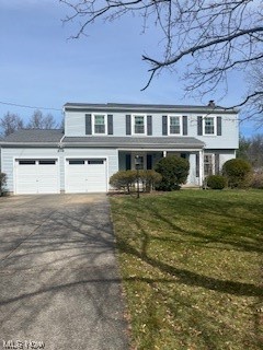 Opportunity Awaits you in this Home. This 4 bedroom 2.5 bath colonial with attached 2 car garage is just waiting for your improvements and personal touches.This home has a spacious living room and formal dining room. The eat in kitchen has plenty of cabinets and counter space. The family room has a cozy wood burning fireplace. There are hard wood floors throughout the majority of this home. The sunroom off of the family room has so much natural light, parquet flooring, and provides extra living space. On the second level are 4 bedrooms. The master bedroom has a master bathroom. The windows have all been updated. The new roof, vinyl siding and gutter guards were updated in 2014. There is a full unfinished basement.