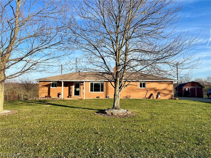 3 bed/1.5 bath Brick ranch sitting on 3 acres of land.  Peaceful, rural setting with great views!  Many recent updates, including vinyl replacement windows, furnace, wood pellet stove, central air, garage door, flooring and more.  Living room with wood burning fireplace.  2 bedrooms on main floor with full bath.  Basement has been recently partially finished, providing an additional 3rd bedroom and potential office room.   Water softener and purifier.  Attached 2-car garage.  Back covered porch perfect for relaxing!  Storage shed.  Range, dishwasher,  washer, dryer to convey to buyer.  This one won't last!