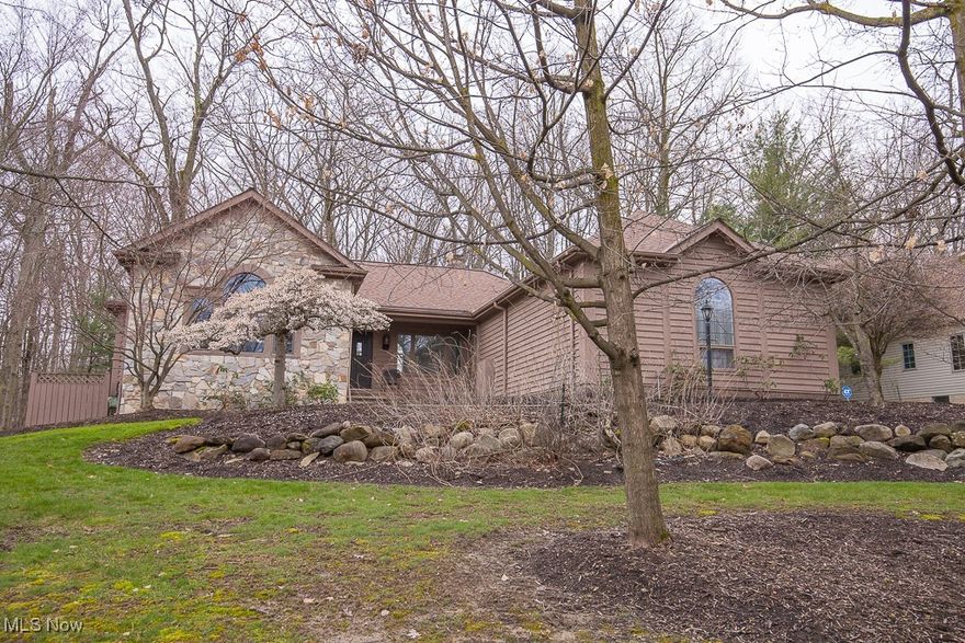 Unique opportunity to own a two-bedroom ranch with a loft in a neighborhood surrounded by much larger homes! The spacious, gourmet, eat-in kitchen is open to the family room and looks out to the serene woods and ravine beyond. The dining and living rooms are set beneath soaring vaulted ceilings and feature a showcase set of windows allowing a stunning view of the woods. There is a cozy, see-through gas fireplace adjoining the living and family rooms. Up the spiral staircase is a charming loft area. The large, primary bedroom has an ensuite glamour bath with a separate shower, jetted bathtub, and walk-in closet. The cabinetry in this suite stays. The second bedroom is being used as an office with beautiful cabinetry and a murphy bed. There is a full, private bath in this suite as well. The main floor laundry room and a half bath off the kitchen completes the main floor. Downstairs is an unfinished basement with plenty of room for storage and/or space to finish to your heart’s desire. This one won’t last long!