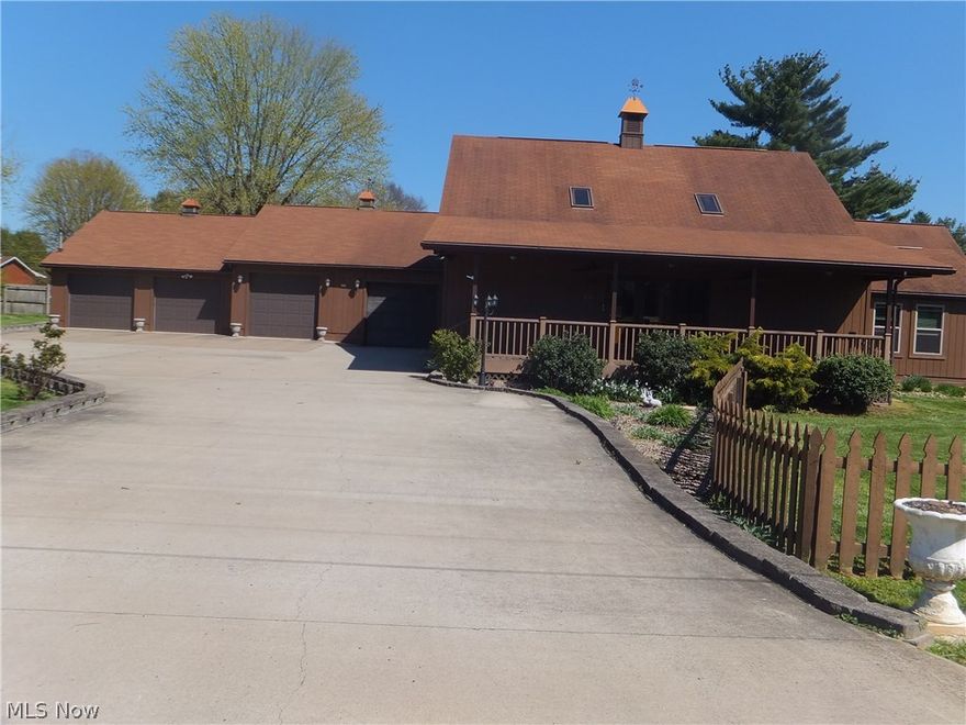 This uniquely styled 1.5 story home has a contemporary flair with a 2nd floor balcony overlooking the 16x35 great room below.  The cathedral ceilings have two skylights to brighten the room below and a gas fireplace to add warmth to the great room.  The main floor has a 17x22 family room with vaulted ceiling and a large bay window.  Enjoy the laundry duties in the 12x14 laundry room off kitchen.  For entertaining, a 10x28 front porch and 15x18 sun room are available.  Have lots of vehicles & toys such as boat, RV, over sized truck?  No problem with the 4 stall garage with (2) 9' doors, OH YES, don't miss the guest house that has 600 square feet of living area and a workshop below.