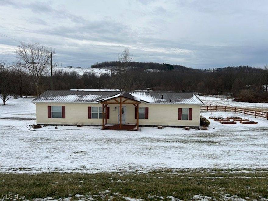 Bring your horses!! Three bedroom, 2 bath open concept home, with fireplace . 2 stall horse barn, 1 acre electric fenced in yard, 12 x 6 tack room, 2 8 x 12 horse stalls, 32 x 50 garage.