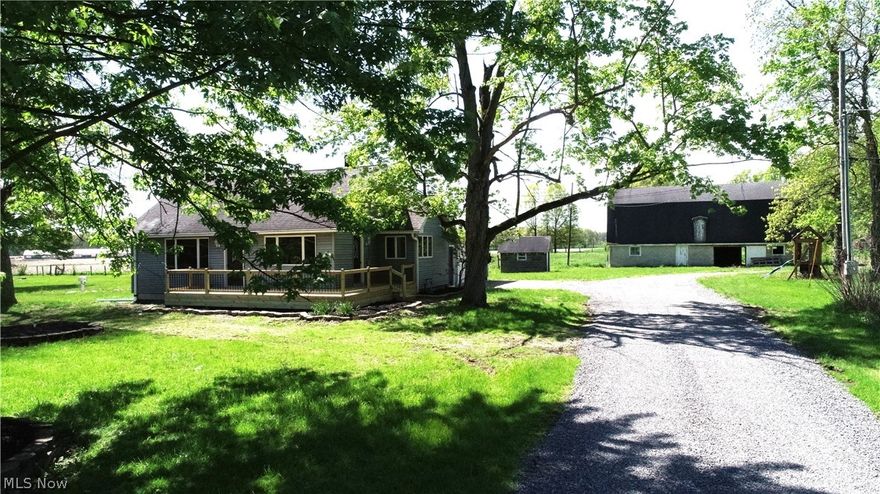Charming 3-bedroom, 1 bath, cape cod on 5.1 acres, remodeled throughout, move in ready with immediate possession and free gas. Features include all newer flooring, updated bathroom, full basement, brand new deck overlooking a peaceful setting.  The property boasts two barns-one ideal for cattle or horses, other perfect for storing farm machinery.  This home has plenty of space inside and out, for combining country living with modern updates.