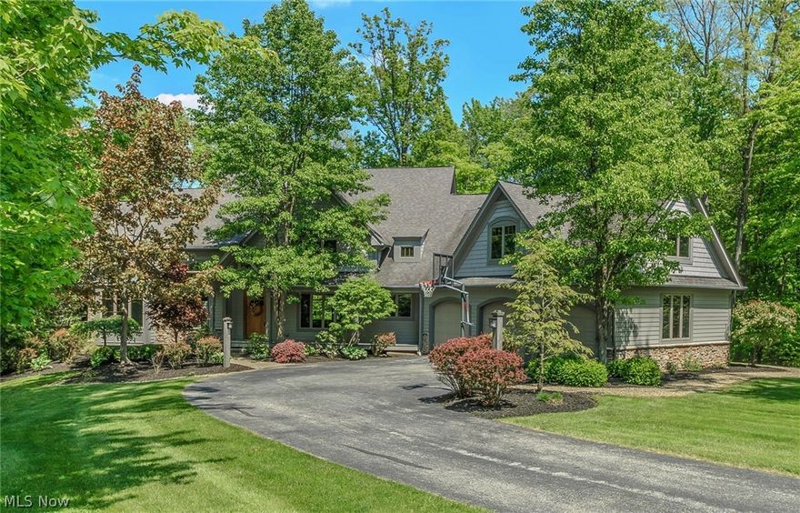 Impressive Payne and Payne built four bedroom colonial on beautifully landscaped 5.03 acre cul-de-sac. Open floor plan allows for fine living and easy entertaining. Enjoy the changing seasons through the wall of windows in great room with full stone dual-way gas fireplace and vaulted ceiling or in the inviting four-season sun room. Gourmet eat-in kitchen with granite countertops, Viking built-in range, recessed lighting, and a two tiered island for extra prep space. Open dining room with built-in oak cabinetry, glass cupboards and crown moulding. Master bedroom with deck access, built in lighted display, and transom windows. Features full bath with his and hers vanities, soaker tub and oversized shower stall. Custom, oak walk-in closet with seating bench and windows for natural lighting. First floor library/study space with French doors, bench seating, and custom woodwork. Second floor offers three nice sized bedrooms with Jack & Jill bathrooms and spacious walk-in closets. Unfinished