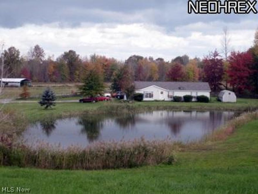 FREE GAS!  95.8 acres with some of everything- 3 bedroom, 2 bath manufactured home on cement crawl is real estate.  Home is spacious throughout with large sunroom. Property is very picturesque with valley setting and fenced pastures, meadow, woods. Long winding road takes you thru part of property. CAUV for bio fields, approx. 30-40 acres, to go into effect 2014. Mineral rights to transfer.  30-40 acres of woods. Income from royalties, biograss lease and hobby airplane club. Lots of beauty; lots of potential. Great location! Roof just replaced, along with minor interior repairs. New laminate flooring, roof, range, microwave, dishwasher and freshly painted.