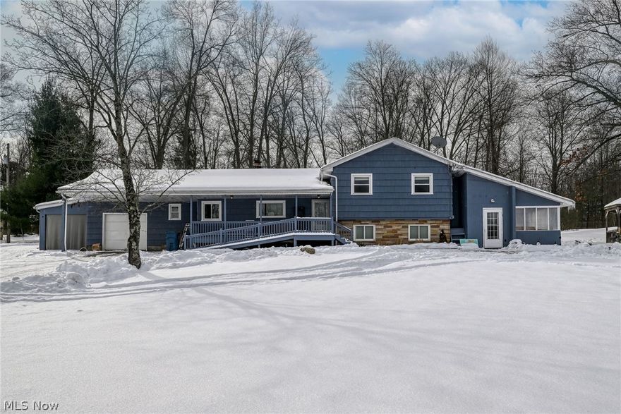Conveniently located close to town while still offering the feel of a peaceful country setting, this large and versatile home sits on 7.3 private, wooded acres and includes multiple outbuilding providing privacy, flexibility, and a rare amount of usable space.

The home offers approximately 1500 sq ft of finished above-grade living space, plus an additional 900 sq ft of finished lower-level living area, for a total of over 2,300 sq ft of finished living space. There is also approximately 558 sq ft of unfinished basement space, ideal for storage or future expansion. The lower-level living area features large windows and a bright, open feel, as it is not fully below grade.

The main living level features a functional layout with a spacious living room, dining area, eat-in kitchen, and a bright sunroom that adds natural light and extra living space. A bedroom and full bath on this level provide convenience and flexibility.

The upper level includes a primary bedroom, two additional bedrooms, and a full bath, creating a comfortable and private sleeping area.

The finished lower-level living area, with its own private entrance, includes a kitchen, family room, sitting room, laundry, and full bath. This space may be used as an in-law suite or as additional living space, perfect for guests, recreation, home office use, or extended entertaining. It's a must see with multiple ways of egress.

Outside, the 7.3 wooded acres offer privacy and a scenic setting while remaining easily accessible to town amenities. Multiple outbuildings provide excellent storage, workshop, or hobby options.

Don’t miss this unique opportunity to own a large home with flexible living space, private acreage, and the convenience of being close to town.