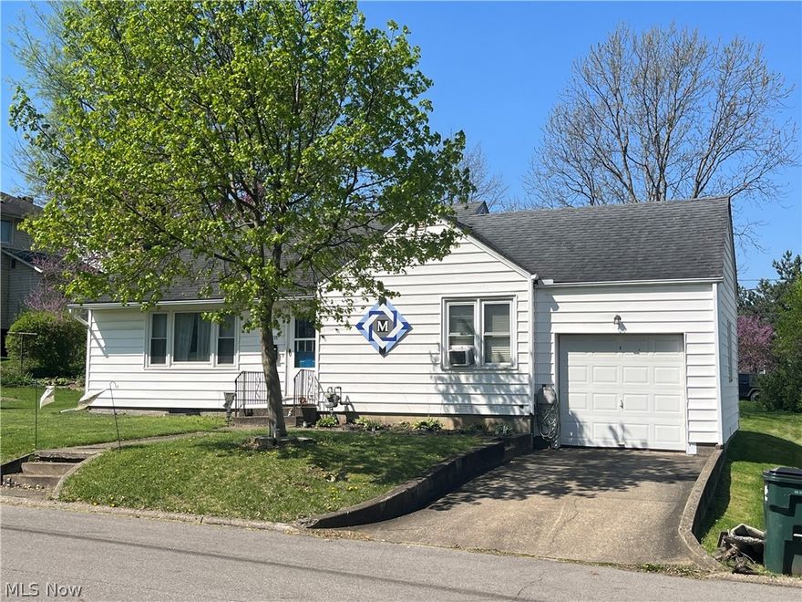 Adorable 2 bedroom bungalow on north end of town. Cozy floor plan with original hardwood floors, wood burning fireplace, back porch leads to patio & private backyard, full walkout basement could easily be finished.  Many updates: windows, roof, floor coverings, some wiring, new sinks in bath & kitchen, new bathroom commode, vanity, & lighing, new gas line & waterline to street.
Most furnishings can stay including lawn equipment.  Great neighborhood with low traffic count. 2 lots total  90x63 = .13 ac.