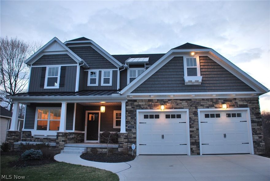 Absolutely stunning home w/ all the extras &upgrades! Open concept from 2-story Great Room w/ entire wall of windows looking into nature, fireplace& awesome ceiling fan to the highly appointed kitchen w/ stainless steel appliances & HUGE Island w/ plenty of seating & granite counter space, walk-in pantry & dining room w/ wall of windows! Laundry room is huge w/ plenty of storage area & laundry chute from 2nd floor. As you walk in the woodcraft front door into the hand scraped wide planked hardwood foyer that is flanked by a home office/library/study that is accented by 6' wainscoting and 9' ceilings and specialty oversized trim along with the locker room leading from large garage. Awesome kitchen has all the extras from reclaimed wood accent, granite countertops, walk-in pantry, GREAT lighting & plenty of storage in the easy close cabinetry to the large open dining area w/ wall of windows, seating a-plenty & door to the exterior (deck needs built to your specs). The 2nd floor has 3 bed