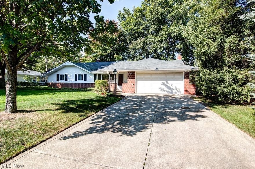 Beautiful Ranch with Updated Kitchen! 3 bedrooms, 2 full baths. Back on the market with beautiful upgrades! Brand new wood laminate flooring throughout main living areas, brand new carpet installed in the bedrooms, and new light fixtures! Welcoming entrance provides a coat closet. Living room features a large picture window that lets in plenty of natural light. Kitchen offers gorgeous wood laminate floors, white cabinets, stainless steel appliances and counter seating and is open to the family room. The wood laminate floors continue into the family room which boasts a brick fireplace and sliding glass doors that lead to the patio and backyard. Separate dining room with a chandelier. Master suite with a stunning private full bath with tiled shower and glass doors, espresso cabinet and neutral decor. Two other good sized bedrooms and another full bath. Convenient first floor laundry room. Two car attached garage. Sprawling backyard with a shed that provides additional storage. Recent upd