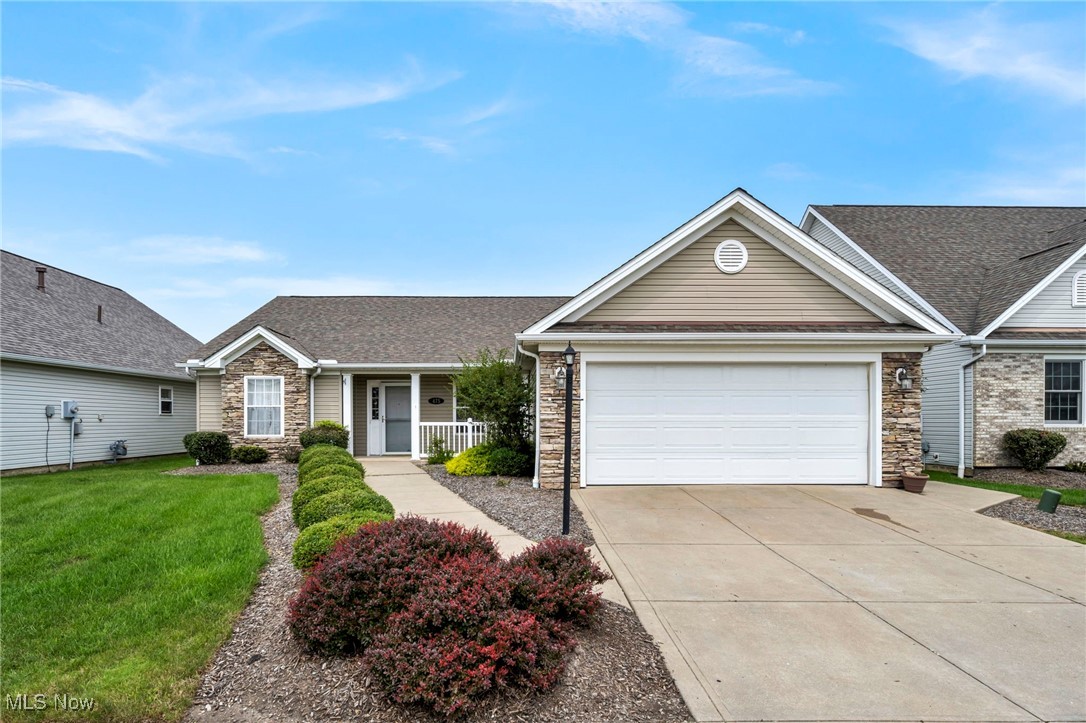 Welcome to this beautifully maintained ranch-style condominium located in the desirable 55+ Autumn Hills Estates community in Seven Hills, Ohio. Built in 2006, this home offers a perfect blend of comfort, functionality, and low-maintenance living. The inviting stone-front exterior and covered front porch lead into a bright, open-concept interior with vaulted ceilings and tasteful ceramic tile flooring. The spacious living room features a cozy gas fireplace with a wood mantle, while the adjacent dining area and eat-in kitchen provide ample space for entertaining. The kitchen includes generous cabinetry, plenty of counter space, and sliding glass doors that open to a charming brick patio—ideal for relaxing or enjoying a morning coffee. All appliances are included, making this home truly move-in ready. This home includes three bedrooms and two full bathrooms. The primary suite is a peaceful retreat, offering a vaulted ceiling, a walk-in closet, and a private bathroom with tile finishes and a linen closet. The second bedroom is well-sized, while the third offers versatility as a guest room, office, or den. Additional features include a large laundry room, a two-car attached garage with hot and cold water, a floor drain, and an exterior man door. Water spigots on both sides of the home and professional landscaping add further convenience and curb appeal. Close to local shopping, dining, and medical facilities. Notable nearby areas include the scenic Cuyahoga Valley National Park, Brecksville Reservation, and West Creek Reservation, both popular for outdoor recreation. In addition, downtown Cleveland is just 20 minutes away, providing access to the Cleveland Clinic, professional sports venues, cultural institutions like Playhouse Square, and vibrant dining and entertainment options. Whether you’re downsizing or looking for a peaceful place to retire, this move-in-ready home is a rare find in a well-kept, friendly community with easy access to everything.