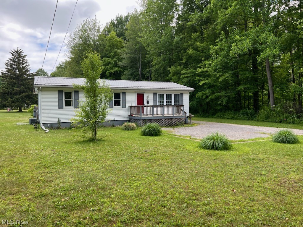 First home? Downsizing? Air BnB? Move right in to this open style, fully furnished 3 bedroom Buckeye ranch. Update include newer metal roof, kitchen, bath and newer windows throughout. Living room features large bay window. Situated on .53 acre. Property offers a huge garage and shed. Wooded view next door.