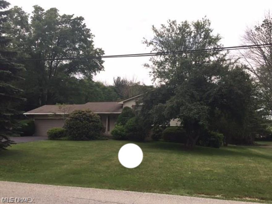 Wonderful area of homes! Well maintained 4 level split with 4 bedrooms and 2 1/2 bathrooms. Formal dining room, eat in kitchen. Plenty of closet space. Walk out family room with sliding door to patio. Beautiful setting on nearly a half acre lot. Deck. 2 car attached garage with newer garage door (2007). New neutral carpet to be installed in living rm, stairs and hallway. Newer hot water tank (approx 2007-2008). Laundry room in basement plus additional room for storage.