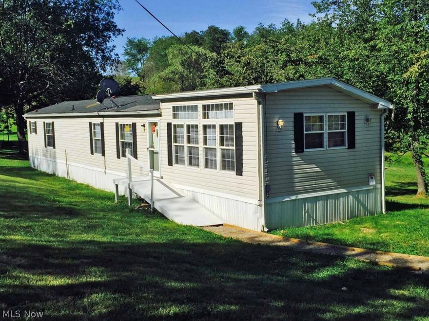 Nice country setting.  Clean mobile home includes kitchen appliances, first floor laundry, 2 bedroom and 2 full bathrooms.  Large eat-in kitchen has raised roof and lots of windows to let in natural light.  Sits on just over an acre.