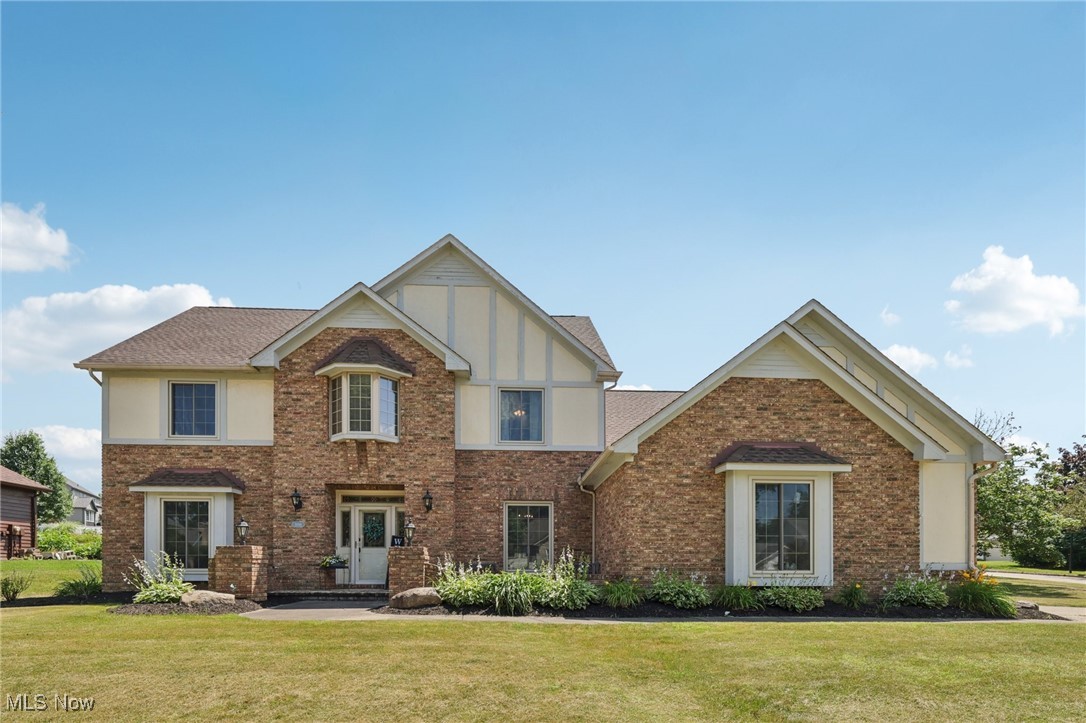 Welcome to 1101 Partridge Dr in Wadsworth, OH! This stunning home features 4 bedrooms, 3 bathrooms, and nearly 3,000 square feet of living space on a corner lot, accentuating its beautiful brick exterior. Upon entering, you're greeted by a welcoming foyer with a grand staircase and heated coat closets, perfect for chilly days. The interior is bright and inviting, with wood flooring installed in 2022 and fresh paint. Updated light fixtures from 2023 to 2024 add a modern touch to the first floor. A versatile home office, which can double as a fifth bedroom, is conveniently located on the right as you enter. The spacious kitchen boasts granite countertops, while the living room offers vaulted ceilings, a cozy fireplace, and a wet bar. Upstairs, you'll find four bedrooms, including an expansive owner’s suite with a walk-in closet, jacuzzi tub, and updated shower. The clean, finish-ready basement offers nearly 1,500 additional square feet. Outside, a charming back patio complements the home’s timeless crown molding and hardwood doors. Recent improvements include a new roof in 2019, new HVAC in 2022, concrete porch and expanded driveway poured in 2023, New front windows installed in 2024 that come with a 10-year warranty. Need more? This property is just minutes away from everything you need in Wadsworth. You’ll find Buehler's Fresh Foods, ALDI, Walmart, Applebee's Grill + Bar, the beloved local favorite The Galaxy Restaurant, Starbucks, and much more, all within a short drive! If you’re in search of the perfect home, look no further! Contact our office today to arrange a showing or to submit your offer!