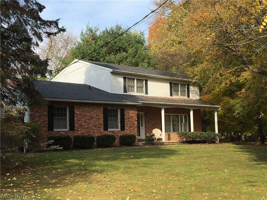 Awesome 11+ acre setting for this stately 4 bedroom, 2 1/2 bath colonial with FREE GAS HEAT!!!  All mineral rights transfer with this rare find in Brimfield Township just minutes from I-76.  Over 250' road frontage and privacy sitting far back off the road.  Several acres of good timber and several acres of tillable land for a great combination to farm and enjoy!  Come and take a look for yourself.  With over 2200 square feet of living space, you will love putting your own special touches on this classic family home.  Lovely attached sun porch to the rear allows you to enjoy the view of your private setting.  Extra 28x38 pole barn to accommodate equipment or convert to a horse barn. Furnace only 5 years old.  Loads of potential here!