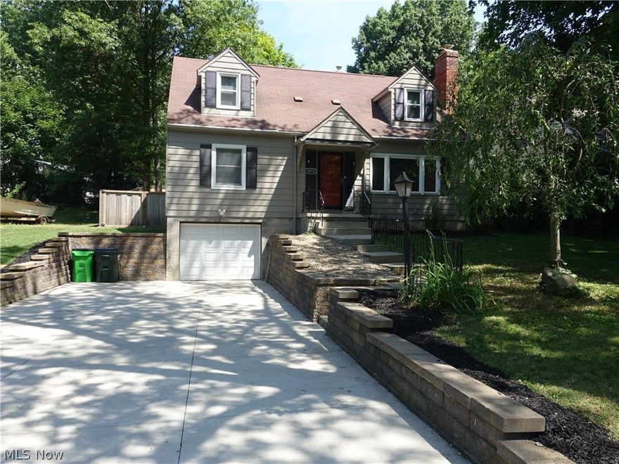 Looking for charm & an updated home in Silver Lake?  Spacious living room with beautiful wood burning fireplace, hard wood floors, recessed lighting and large picture window, which allows for an abundance of natural light.  Stylish and updated kitchen is bright and beautiful and features newer cabinets w/ soft close drawers, pantry with pull out drawers, granite counters, island/breakfast bar and appliances.  Barn door leads you to the convenient first floor laundry with a slider to backyard (throw a load of laundry in and relax outside)!  There's even a powder room and family room with beams and another access to backyard.   Two bedrooms and full bath complete the first floor.  The second floor features a huge bedroom with full bath/walk in shower and nice closet space.  Enjoy the  oasis of your backyard with a patio and cedar fence for total privacy.  The attached 1 car garage is extra deep so there's plenty of room for a motorcycle or other storage and the driveway is extra wide.  R