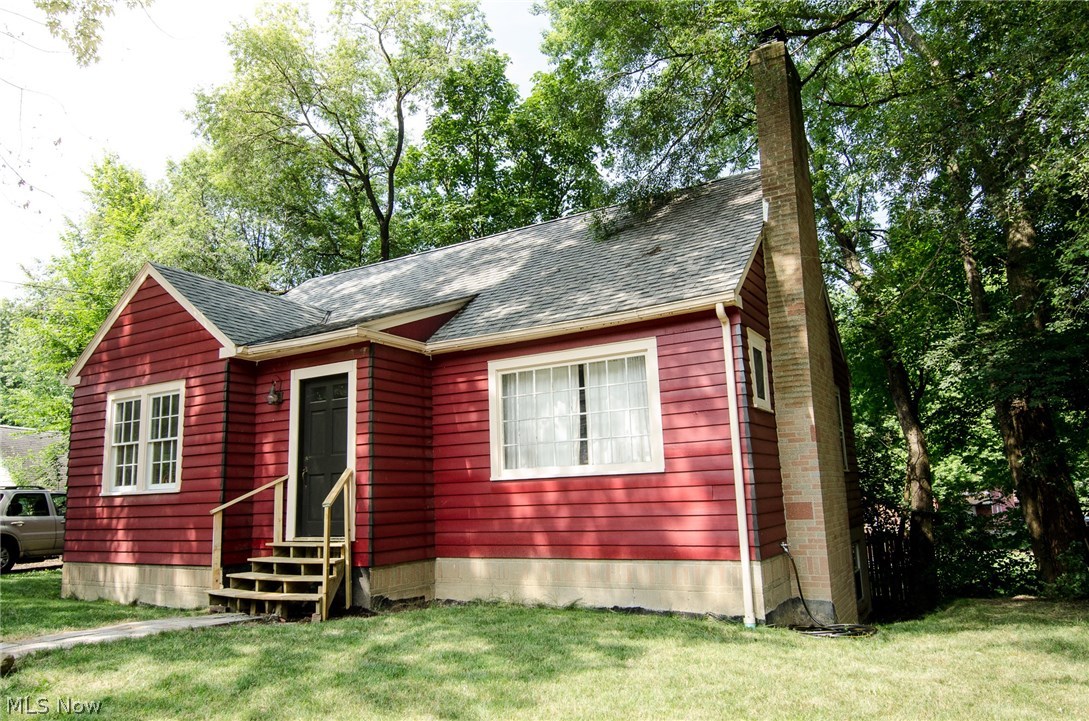 Beautiful single family home with all of the charm of a Kent. This Ranch has been recently painted with brand new stairs for great curb appeal. You will feel right at home when you see the original hardwood floors, wood burning fireplace and built-ins. Hardwood floors run through the entire main floor. The dining room provides a great space for your table and has a coat closet. The large kitchen come equip with a stainless steel refrigerator, awesome gas range, matching range hood and lots of storage. There are 2 bedrooms and the main bathroom on the first floor. Down stairs you will find what's used as the huge master bedroom. This space has lots of windows and a walk out to the back garden. This could also be a great rec room or a rental suite. You will also find another 3 piece bathroom, laundry, tons of storage and the utility area on the lower level. Garage is attached to the screened in breezeway, which would be a great hang out spot. Lot provides enough room to park