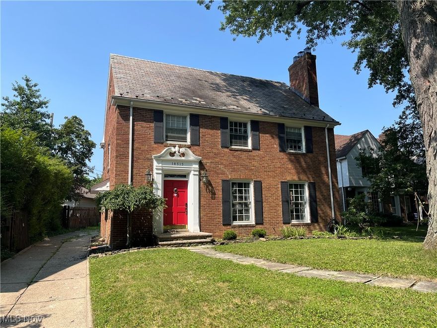 Located in the picturesque Lomond District, this all-brick Colonial Revival is full of character, space, and timeless appeal. Featuring a slate tile roof, 3 fireplaces, and original architectural details, this 4-bedroom, 3.5 bath home offers the best of classic Shaker Heights living- just minutes from Griffey Triangle Park, Shaker Town Center, Van Aken District, shops, restaurants, and multiple Blue Line RTA stops. Inside, a foyer showcases the elegant staircase and sets the tone for the home's rich craftsmanship. The main floor layout flows beautifully, with hardwood floors throughout, a spacious living room with fireplace, and a formal dining room featuring two corner built-ins and double glass doors that open to the back patio. A cozy breakfast nook with a built-in hutch connects to the kitchen, which offers granite countertops and SS appliances. A covered back patio is easily accessed from here-perfect for dining al fresco or relaxing in the shade. Upstairs, the primary bedroom is a true retreat with hardwood floors, a second fireplace, and a dressing room featuring damask wallpaper, built-ins, and private bath access. Two additional bedrooms share a Jack-and-Jill bath with classic original tile. The third floor includes a fourth bedroom, and full bath, ideal as a guest suite or private office. The lower level is partially framed with some newer drywall and includes a third fireplace, laundry room with washer and dryer (2023), and storage and utility areas-ready for finishing touches to add even more space. Major updates include a boiler (2021), 50-gallon hot water tank (2021), an a new garage roof on the 2-car detached garage (2025). With historic charm, solid bones, and space to grow, this home is a rare find in one of Shaker Heights' beloved neighborhoods. Come see the potential and make it your own!