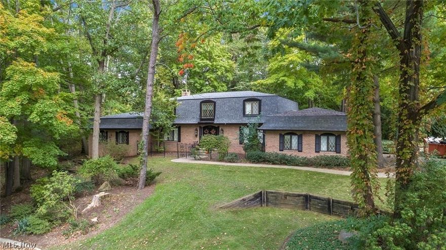 WOW A DEFINITE MUST SEE !!  Beautiful French Normandy style home boast approximately 5,000 square feet of living and entertaining space. Double doors open to spacious foyer flanked by the living and dining areas. The sweeping, open and flowing first floor grants abundant space for entertaining. Large, eat in kitchen with bay window, multiple closets, pantry area. Stained glass window overlooking private, wooded backyard. Kitchen opens to a  2nd office and access to garage. The curved stairway adds to the ambiance and leads to a stunning Master suite w/ his and her full baths and 3 generously sized bedrooms. Private Guest room w/ full bath can be found on the 2nd floor. Finished rec room in lower level offers additional living space. Other features include : Large  walk in wine cellar, Roof in 2014, newer aC, Furnace, dishwasher-2019. Tucked away at the end of a cul-de-sac,  this grand residence is looking for a new owner to make there own memories here.