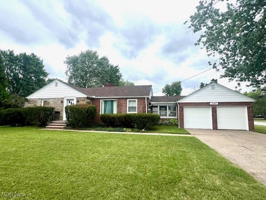 Large corner lot!  2 car garage with loft storage.  Breezeway opens to large rear porch overlooking yard. Updated kitchen.  Large living room with fireplace.