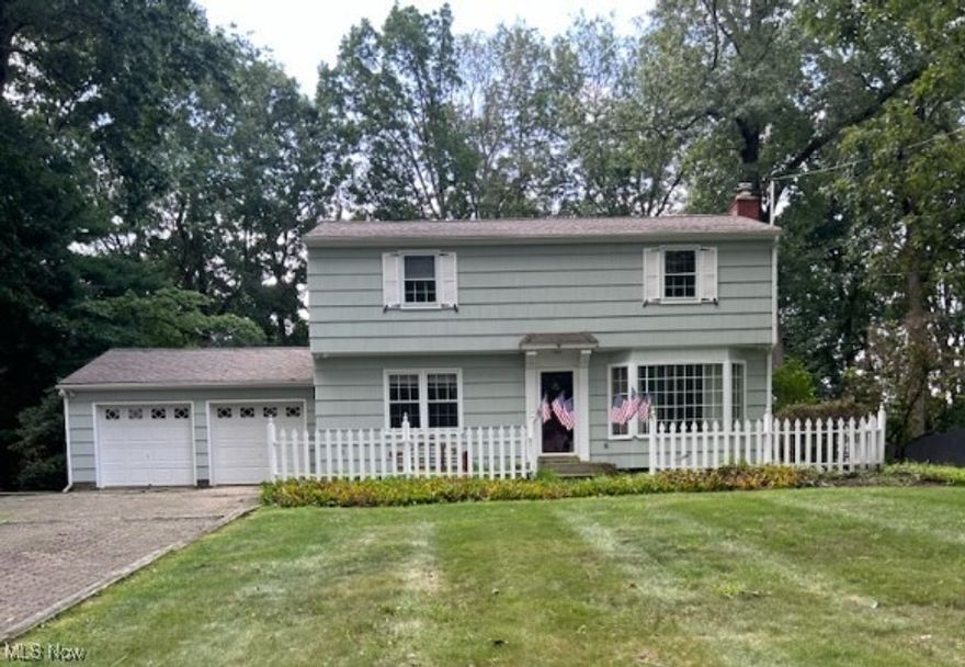 MOTIVATED- Selling as is !!! Welcome to this beautifully maintained 2-story Colonial-style home nestled on a full acre in a serene and private setting. This 3-bedroom, 1.5-bath home offers timeless charm and plenty of space, inside and out. Step inside to find a traditional layout with spacious rooms, large windows for natural light, and a cozy atmosphere perfect for family living. The main level features a welcoming living room, an inviting dining area, and an efficient kitchen. Upstairs, you'll find three generously sized bedrooms and a full bath. The attached 2-car garage provides convenient access and ample storage, while the adjacent charming greenhouse is perfect for gardening enthusiasts or as a relaxing backyard retreat. The yard is lined with mature trees and backs up to peaceful woods—offering a quiet and picturesque outdoor space ideal for relaxing, entertaining, or exploring nature. Don’t miss your opportunity to own this classic home in a park-like setting—peaceful living just minutes from town amenities!