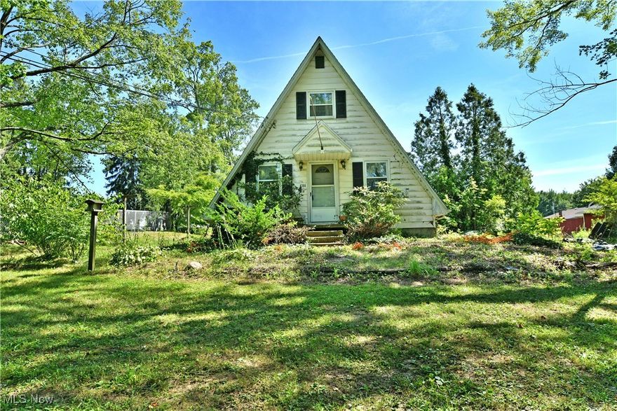 Rustic charm meets affordability at this cozy A-frame in Johnston Township! Nestled on a half-acre lot in the Maplewood School District, this 2-bedroom, 1-bath home offers just over 1,000 square feet of character and potential. Built in 1969, the home features baseboard heating, well water, and a septic system—country living made simple! Whether you're looking for a weekend getaway, investment opportunity, or a place to make your own, this unique property offers the perfect blank canvas.