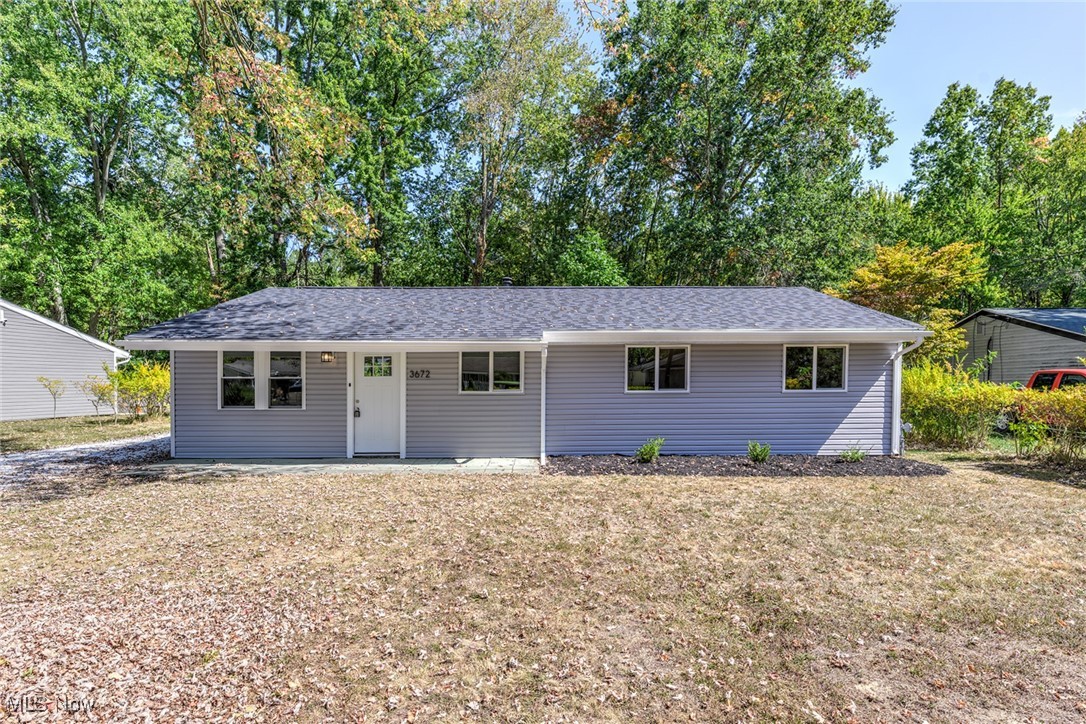 Welcome to this beautifully updated 3-bedroom, 1.5-bath ranch in Brimfield. Step inside to find a fully remodeled kitchen featuring granite countertops and brand-new stainless steel appliances. The home offers fresh flooring throughout, with durable luxury vinyl plank in the main living areas and cozy carpet in the bedrooms. Both bathrooms have been tastefully renovated, and comfort is ensured year-round with brand-new central air. Major updates include a new roof, siding, and windows, giving you peace of mind for years to come. Outside, enjoy a private backyard with a wooded view, perfect for relaxing or entertaining. A large shed provides plenty of storage space. Nestled on a quiet street yet conveniently close to the highway and all amenities, this move-in-ready home truly has it all.