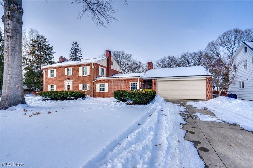 This brick Georgian Colonial is the kind of home people wait for. It has been carefully maintained and thoughtfully updated. At 3,053 square feet plus a partially finished basement, it offers space that feels comfortable rather than oversized. The curb appeal immediately sets the tone, and that feeling carries through every room. The family room is the heart of the home and where you will want to spend your time. Offering a vaulted ceiling, exposed beams sourced from a local barn, custom built-ins, a large window seat overlooking the professionally landscaped yard, and a cozy wood burning fireplace with brick from floor to ceiling. From the family room, a door is cleverly placed that will lead you to the enclosed porch and patio. The eat-in kitchen is designed for daily life, with newer appliances, generously sized pantry cabinets, and smart hidden storage that makes the most of the space. Close to the kitchen and entry, you'll find a guest half bath conveniently placed on the main floor. A large formal living room with a second fireplace anchors the front of the home, while a spacious den and sitting area are tucked behind it. These rooms provide great backyard views of the .39-acre corner lot. A large formal dining room has french doors for when the weather breaks and you want the fresh air. Upstairs, all four bedrooms and two full baths are together, each room filled with character and charming built-ins that reflect the home’s era. If you prefer hardwood flooring then you'll be happy to know that is what you will find under the flooring in the bedrooms and living room. Outside, the enclosed porch and the 16x18 paver & stone terrace patio with built-in grill extend the outdoor living space. The basement has a partially finished rec room with 3rd fireplace, laundry area and tub plus plenty of storage space. Experience the charm and character of this home which is only accomplished once inside!
