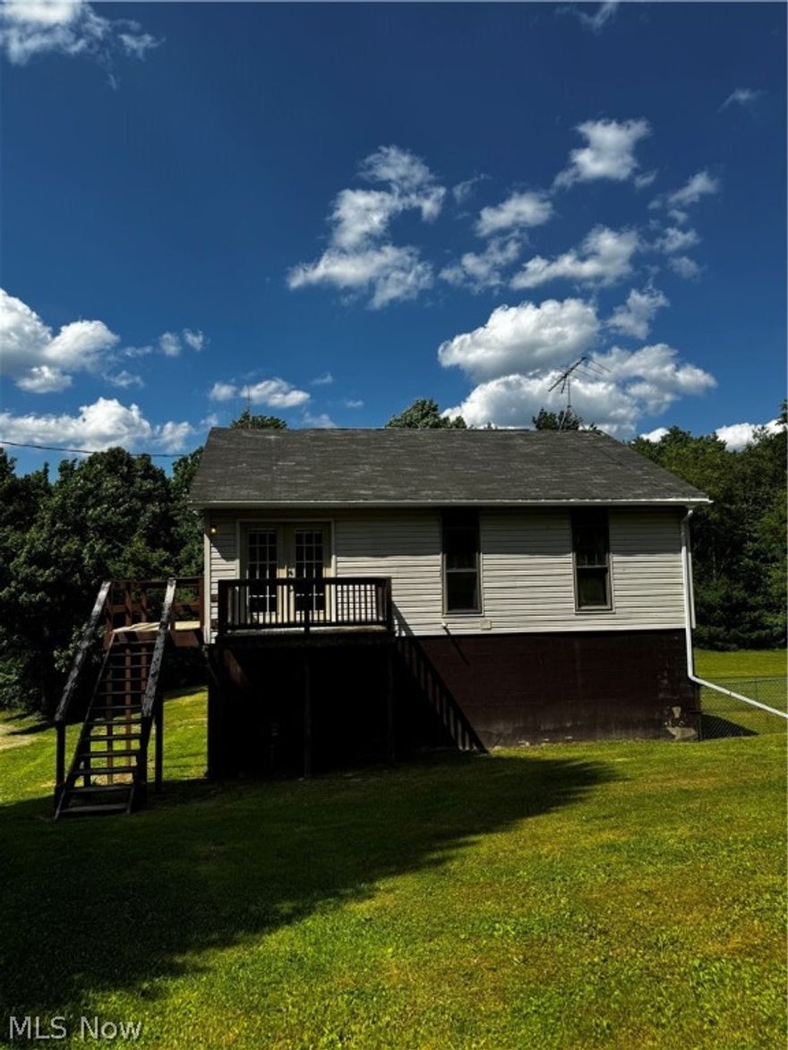 One bedroom, two full bath home tucked away on 1.26 acres for your own privacy to enjoy those summer days! Home is built above an exceptional high garage that would satisfy any type of mechanical work. Property is being sold as is.  There are some repairs needed.  Home has new kitchen nice large room sizes and repairs needing done will not hold you up from moving in.  Both toilets have been replaced and Home is clean and ready to go.  The acreage has been changed from .96 to 1.26.  New survey is done but just not recorded yet.