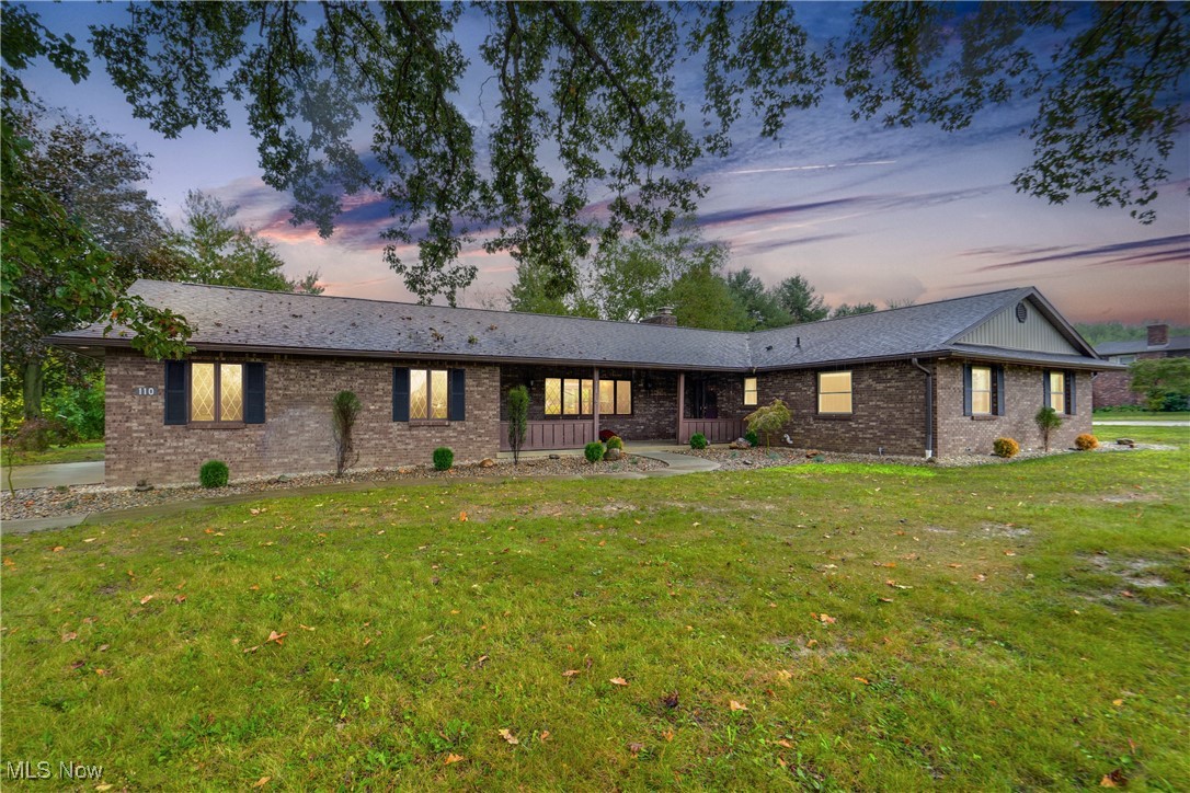 Step into your dream ranch at 110 S. Kansas Road in Orrville. This stunning three-bedroom, two-full-bath home has been beautifully renovated top to bottom, ready for its next owners. The heart of the house shines with a completely updated kitchen boasting granite countertops, sleek stainless appliances, and under-cabinet lighting. Gorgeous hickory hardwood floors flow through the main level, while the dining room captivates with a cozy stone fireplace and vaulted ceilings, opening to a three-season room that leads to a brand-new stamped concrete patio-perfect for fall evenings! Both bathrooms have been thoughtfully redesigned to impress, and the fully finished basement is waterproofed with a transferable warranty for peace of mind. Outside, a fresh roof, vinyl siding, gutters, and lush new landscaping tie it all together. With a spacious three-car garage and every detail polished, this wow-worthy home demands a visit-you won't want to miss​​‌​​​​‌​‌​​​‌‌​​​‌‌‌​​‌​​‌‌​​​​ it!