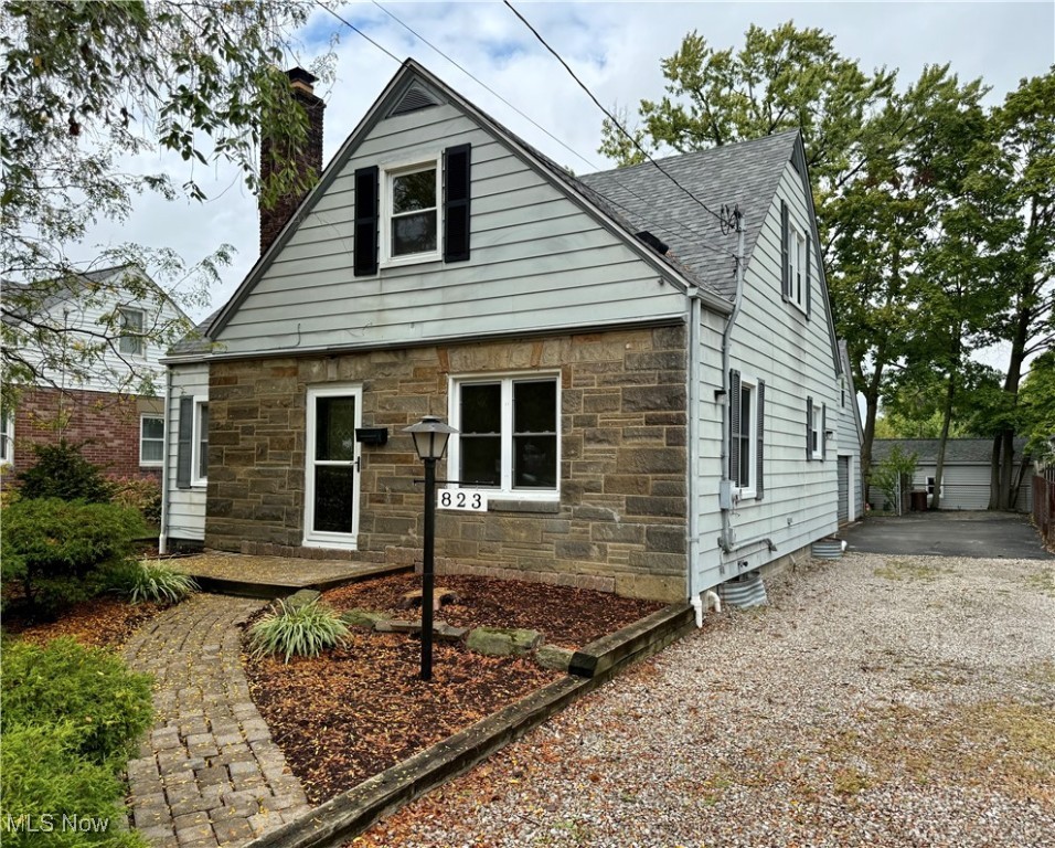 Step into this move-in ready 4-bedroom, 2 full bath Cape Cod in Cuyahoga Falls that’s packed with updates and charm! With almost 1,300 sq. ft. of thoughtfully designed space, this home checks ALL the boxes: a spacious 2-car attached garage with bonus storage above, and a light-filled 3-season porch/breezeway that’s just been refreshed with brand new paint and carpet—perfect for coffee mornings, game nights, or a spot to kick off muddy shoes after the park. Outside, enjoy fresh landscaping and peace of mind with a brand new 30-year architectural shingle roof on both the home and garage. Inside, everything feels new with fresh paint, two completely remodeled bathrooms, granite countertops in the kitchen with new hardware and fixtures, new stainless appliances, durable LVT flooring and refinished hardwoods that keep the classic character. Other big-ticket updates include vinyl windows, a brand new LG mini-split A/C unit, updated boiler system and professional basement waterproofing - giving you comfort and confidence! The location is unbeatable—close to Portage Crossings, Route 8, local parks, and only a few blocks from the brand new Cuyahoga Falls 6–12 Grade Campus. If you’re looking for a stylish, updated home in a prime spot, this is the one you don’t want to miss. Schedule your showing today!