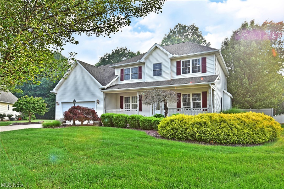 Lose yourself in the studiously crafted interior of this profound New Middleton home! Set deeply into a desirable development, the prominent residence exudes class with its perfectly manicured red stone landscaping and relaxing, covered front patio that hides in the privacy of tall trees. The fenced in backyard enjoys winding brick patio space with a built-in grill and firepit. The two-story foyer showcases the second story catwalk as a mix of tile and polished cherry flooring runs below, spilling into the nearby formal dining room and family rooms alike. The central kitchen provides a wrapping stone countertop with bartop seating. Casual dining space overlooks the rear patio via French doors. Meanwhile, sunlight cascades through the nearby picture windows and dances across the great room fireplace and main stairway. The first floor is completed by a half bath, laundry services and a fourth, guest bedroom. Upstairs, three other bedrooms branch from the landing to include a full bath wi