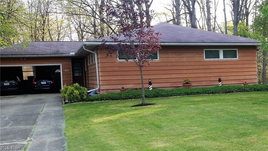 One of a kind Northside 4 bedroom ranch on a ravine lot. Features include a foyer entry, Large spacious  living room with fireplace. Beautiful sun room off living room with panoramic view of nature at its best with access to the lush landscaped garden area boasting a Japanese Maple, Weeping Cherry Tree and many perennials all within the white picket fenced area. Updated kitchen with breakfast bar, formal dining room with great view of back yard. 2 full baths .  Full basement that is partially finished, with open half bath. Many possibilities for your finishing touches.  Basement water proofed (2012) with transferable warranty. New Central Air 2016, Sun room, furnace, roof done around 2003. Attached 2 car garage. Home is equipped with a security system. New storage shed. Very quiet area, yet close to LCCC, Rte 2 and I-90. Seller is including a home warranty.  Schedule your private showing today.