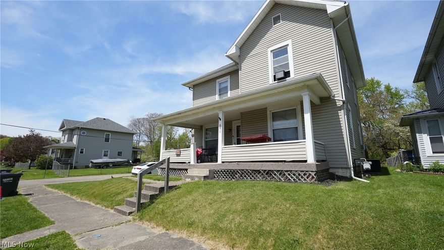Welcome to this spacious 3-bedroom, 2-bathroom home featuring a charming covered front porch. Situated on a large corner lot, this home boasts beautiful woodwork and a decorative fireplace, adding warmth and character. Complete with a one-car detached garage, gas heat, and public utilities, it offers both comfort and convenience.