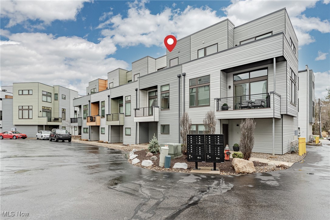 Stylish and modern townhouse in a prime Fairview Park location! This newer unit offers over 1,000 sq ft of well-designed living space. The first floor includes an attached garage, foyer, and coat closet, while the main living area upstairs features an open-concept layout with a cozy fireplace, TV alcove, and sliding doors to a private balcony. The kitchen boasts quartz counters, stainless steel appliances, a subway tile backsplash, and a breakfast bar, with a convenient half bath nearby. The top floor is a dedicated primary suite with a spacious bedroom, walk-in closet, laundry closet, and a luxurious ensuite bath with a double vanity, soaking tub, and step-in shower. Enjoy an additional private balcony off the suite. Located above the Rocky River, this home is just moments from shopping, dining, Kamms Corner, and easy highway access. A fantastic opportunity in a sought-after area!