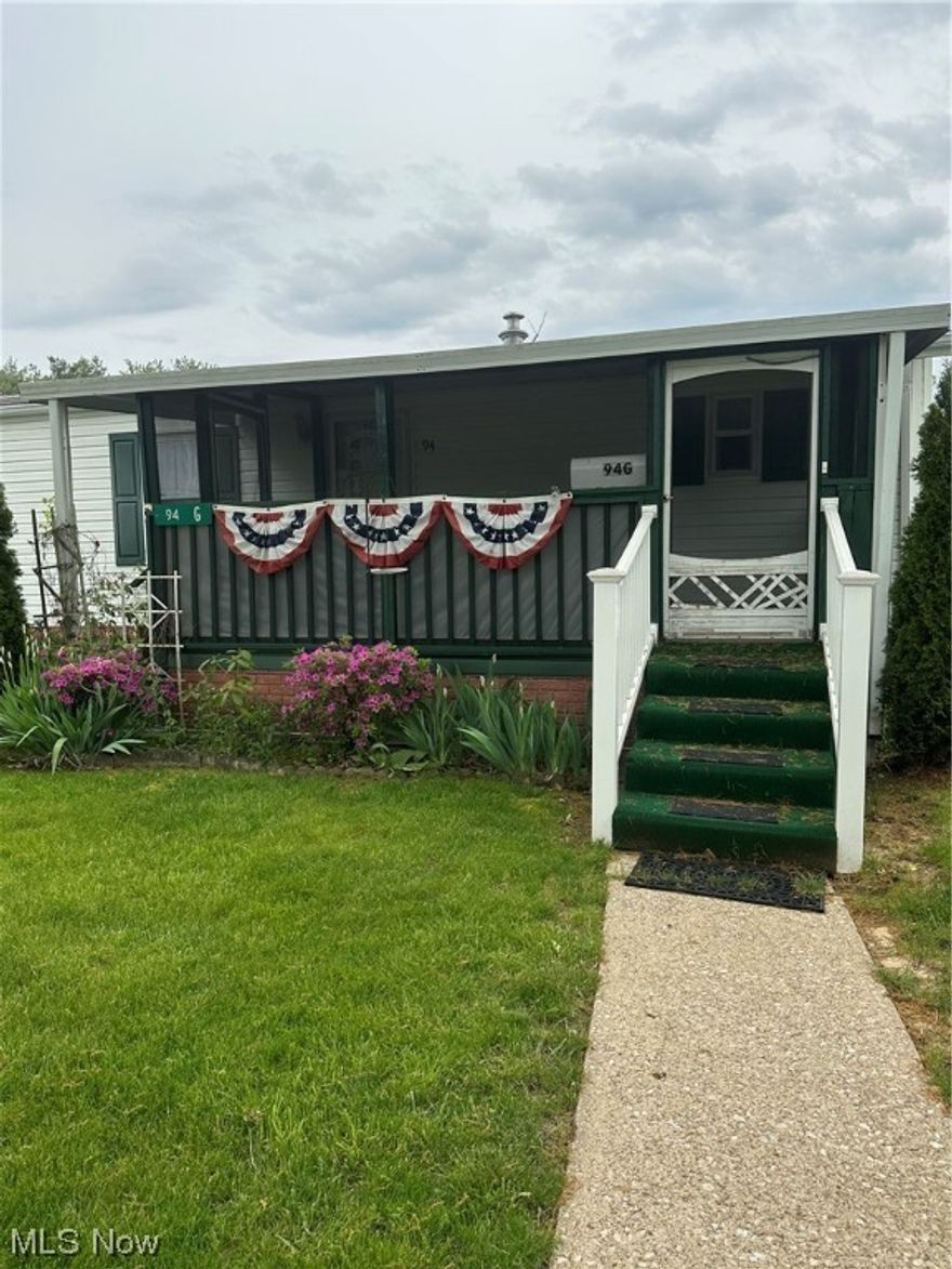 Great opportunity to own this well-cared for manufactured home, located in the desirable Navarre Village community. Perfectly situated on a cul-de-sac with a yard that boasts beautiful landscaping. Immediate possession of this 2-bedroom home. Includes all window treatments, cathedral ceilings in the living room & kitchen, skylight in the kitchen, lots of cupboards, ceiling fans, master bath with a walk-in shower and main bathroom with a walk-in tub, appliances to include - washer/dryer, fridge, range, and microwave. Two-car carport & shed remain, 3-season screened-in front porch. Lot rent includes trash, water & sewer.