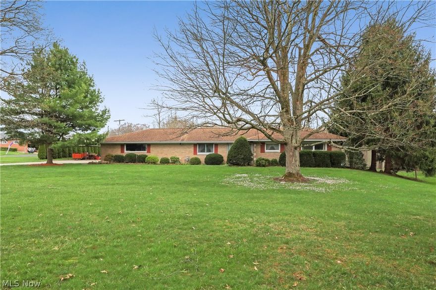 Don't let this one get away! Well constructed and cared for three bedroom brick ranch in Marlington Local Schools just minutes away from Washington Elementary School. You'll love this quality eat-in kitchen with tile countertop, pocket door, gas fireplace, and plenty of natural light. Living room features a wood burning fireplace for those cozy nights at home. Just off the living room is a bonus gem - a sunroom with electric heat and a wood burning stove. This area is a great space for enjoying the sunshine and views of your spacious backyard. All three bedrooms have beautiful custom built-in closets. Master bedroom features double closets and exterior doors that open to a patio complete with a hot tub. The main bathroom in the sleeping area was recently and thoughtfully updated. There is a second full bathroom between the kitchen and attached, heated garage for added convenience. So much extra space in this basement! Lots of room for storage or additional living space. Tons of options for enjoying the outdoors with this property! House runs on a low voltage electric system. All sizes, dimensions, and ages are estimated.