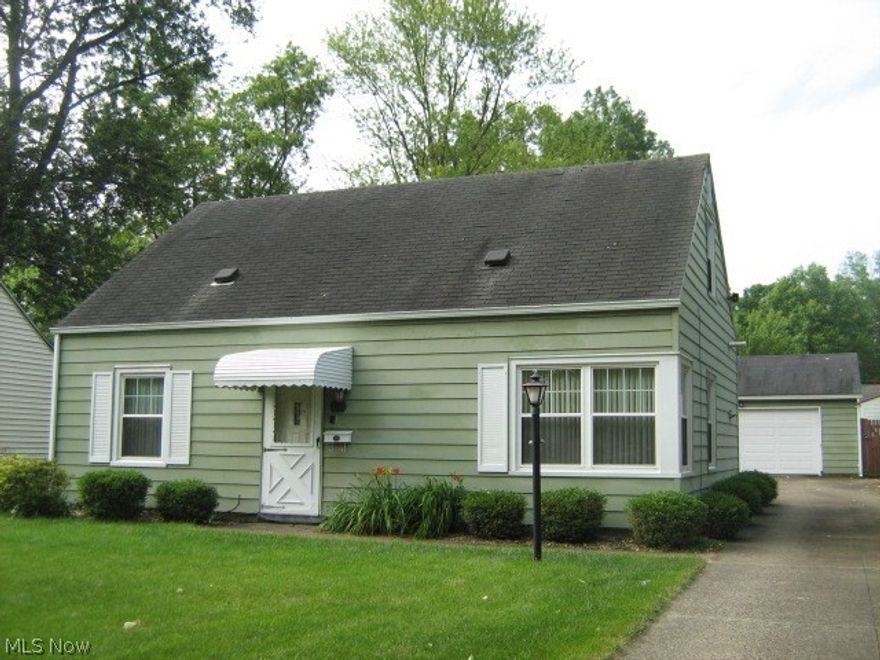 Affordable Cape Cod features 3 good-sized bedrooms plus a den/office with built-in bookshelf wall!  Excellent closet and storage space.  Lighted ceiling fans.  All appliances included and Baldwin piano can stay!  Enjoy summer on the brick patio.  Partially fenced backyard.  Nice level lot.         2 1/2 car garage has add-on offering many possibilities.