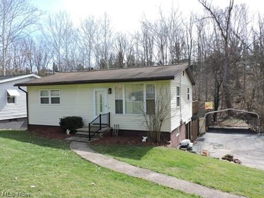 Updated ranch situated in central location near downtown amenities and easy access to State Route 7 and Interstate 77.   Features living room with large picture window allowing natural light to enter the room, ceiling fan and guest closet, updated table space kitchen with nice cabinetry, appliances (refrigerator, range, dishwasher, disposal) and French doors to rear deck for entertaining or relaxing with stairs to the lower patio area to enjoy the hot tub that overlooks the very private fenced backyard,  2 bedrooms with hardwood flooring and updated full bath with tub /shower.   The walk out basement has a nice home office or lower family room, large storage room with easy access from the garage and laundry room with washer, dryer, cabinetry , counter for folding laundry and door to patio and backyard area.    The home has newer gas forced air heating system with central cooling system,  newer windows,  newer hot water tank , newer ceiling fans,  freshly painted neutral interior, new i