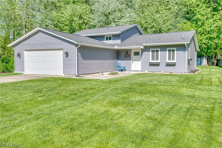 Welcome home to this fully updated, move-in ready split-level in beautiful Mentor! Located on Carter Blvd, this home shines with great curb appeal and an open interior featuring vaulted ceilings, luxury vinyl flooring, and plenty of natural light. The modern kitchen includes granite countertops and stainless steel appliances, flowing into a dining area with sliding glass doors that lead to your backyard oasis. Outside, enjoy a large paver patio, pergola, and a custom stone firepit perfect for entertaining. Upstairs offers three bedrooms with carpet and two with custom closets shelving, along with a sleek bath featuring a tiled shower-tub. The lower level adds more living space with a large family room with a custom wine nook and a second full bath with a walk-in shower.  Storage is a breeze with an oversized two-car garage and a shed in the back yard. Recent updates provide total peace of mind: New roof (total tear-off), siding, and windows (2018), HVAC, humidifier, and duct cleaning (2022); sump pump battery backup (2023). Finishes like custom banisters, recessed lighting, and window treatments including Levolor blinds (2022) complete the look. Call your favorite REALTOR today to schedule a tour!
