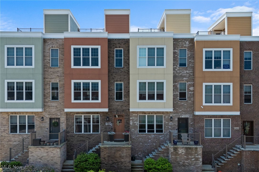 This beautifully designed townhome is likely one of the last opportunities to join the vibrant and welcoming McKinley Place community in 2025. Tucked into the west end of Lakewood, the location offers the best of both worlds: a connected, welcoming community and easy access to everything from the Metroparks trails to Blackbird Bakery and the lakefront.
Thoughtfully designed across three levels, the home is filled with natural light and smart details. The ground floor features a flexible space—ideal as a guest suite, home office, or third bedroom—with its own half bath. A convenient basement (uncommon in townhomes) adds valuable space for storage or future expansion.
Upstairs, wide-plank hardwood floors lead you through an open layout tailored for gathering and everyday ease. The kitchen is a true focal point with a large granite island, coffee bar, beverage cooler, and walk-out balcony complete with gas hookup for grilling. It flows seamlessly into the dining area and living room, where a fireplace and oversized windows create a relaxed, inviting atmosphere.
On the upper level, the primary suite includes a custom-tiled walk-in shower, dual sinks, and a generous walk-in closet. A second spacious bedroom, full bath, and laundry complete the floor—keeping convenience close at hand.
With three distinct outdoor living areas—a welcoming front porch, the balcony off the kitchen, and a full rooftop deck with sweeping views of Lake Erie and the surrounding neighborhood—this home invites both quiet mornings and lively evenings under the sky. You'll adore your 360-degree roof deck with both shade, sun and stunning views of north Lakewood & beyond.
Carefully maintained and part of a warm, walkable community, this is a home that stands apart—not just in design, but in how it lives. Reach out today & be part of one of the best places to live in all of Lakewood & Cleveland's suburbs.