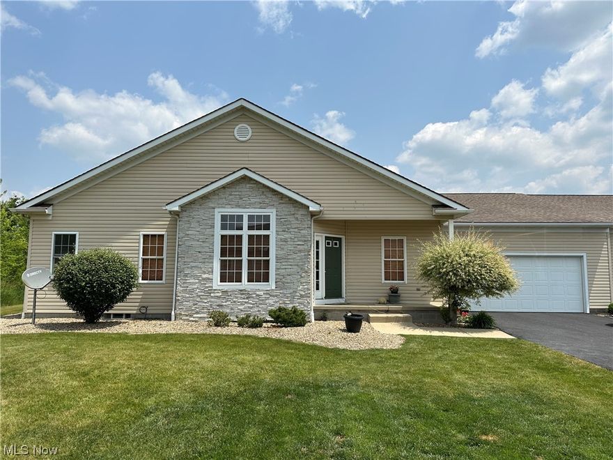 Welcome to Champion.  This Condo is close to everything and yet sits in the back of the development with wooded privacy.  Very spacious 2 bedroom 2 bath condo with tall ceilings.  Each bedroom has its own bath for convenience.  The entire condo has new hard wood flooring.  Sun room that looks out to private wooded area.  Laundry on the main floor next to the Kitchen for convenience.  Large basement for all your storage.  2 car garage.  This condo will not last long!