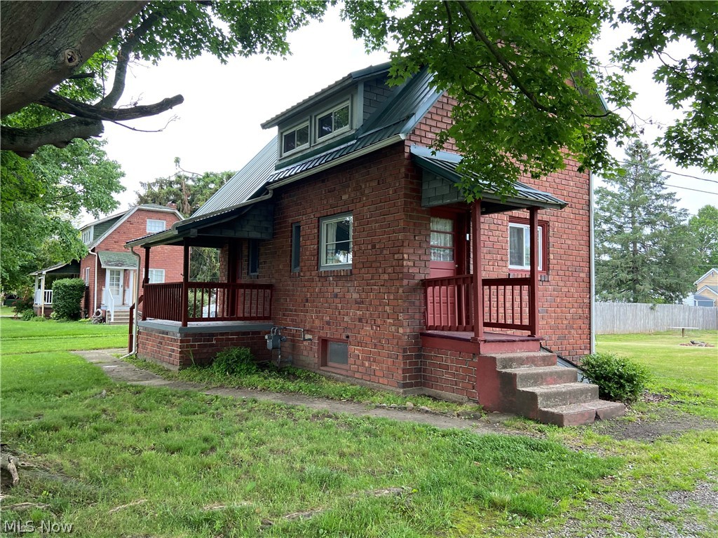 In town property with country view. No outlet street allows for private setting, large yard. Great starter or rental. Living room has hardwood floors. Parquet flooring in dining room with some newer cabinets. Some replacement windows. Metal roof on main house 3 years old. Cozy floor plan. Large fenced yard, detached garage with oversized newer shed. Very nice older basement - great storage. Window air conditioning unit 2 years old can stay. 100 amp breaker service. Updated soil pipe in basement. Gas company recently replaced lines. This is a solid home with much potential. Modify to make your own. Nice property. Quiet area. Privacy fence is placed approximately 3 feet within the property lines.