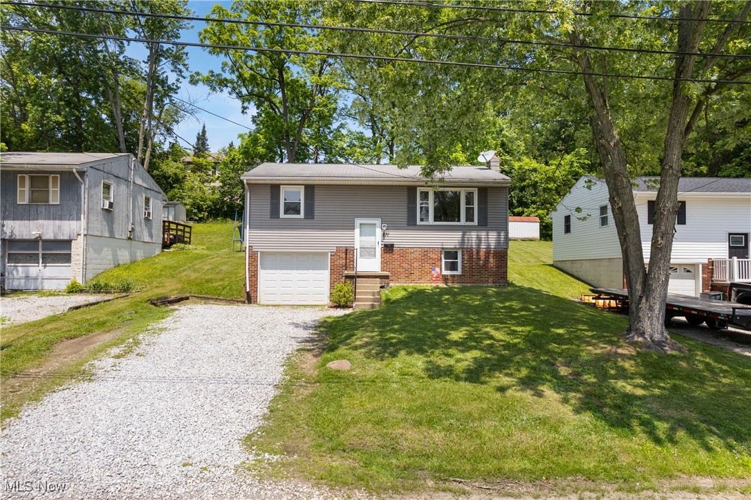 Pull on up to this gorgeous turnkey, bi-level with 3 bedrooms in Rittman City Schools! This charmer has been lovingly cared for and is across the street from the bike trail! The foyer leads up a few steps to a living room with eat-in kitchen. The kitchen boasts stylish white cabinetry with plenty of cupboards. Down the hall are 2 spacious bedrooms and a full bath on the upper floor. The large bathroom features a newer tub and vanity. Down the lower level and you will find a large flex room that can be another family room. In the lower level is another bedroom as well as a storage room/laundry area. Enjoy the backyard on the spacious deck, perfect for summer barbeques. The line of trees along the back make you feel like you are in the country! Close to route 57 and route 585, the location is ideal. This one won’t last! Come take a peek.