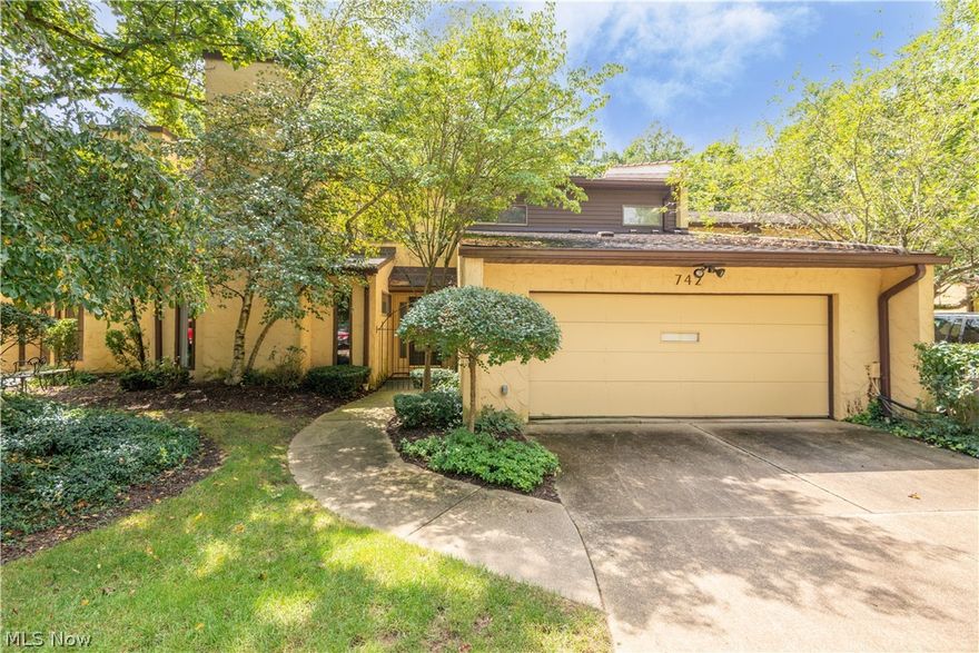 Beautiful well maintained condo in desirable Hampton Ridge development. Prime location offers privacy and quiet with gorgeous wooded view from professionally hardscaped patio. Inviting foyer leads to carpeted living room with carpet, gas fireplace, slider to patio, and wet bar.Updated kitchen features beautiful cherry cabinetry, wood flooring and GE appliances, granite island with sink, corian countertops with additional sink.Cozy carpeted family room off the kitchen with gas fireplace. Formal dining room off of kitchen. First floor laundry room with utility sink and built in cabinets. Large luxury master suite with ensuite bathroom with skylight and two vanities with sinks. two large secondary bedrooms with carpet and large closets, one has ensuite bathroom. Office/sitting room/sewing room. Loads of storage throughout, with great natural light from many windows. Two car attached garage with built ins.