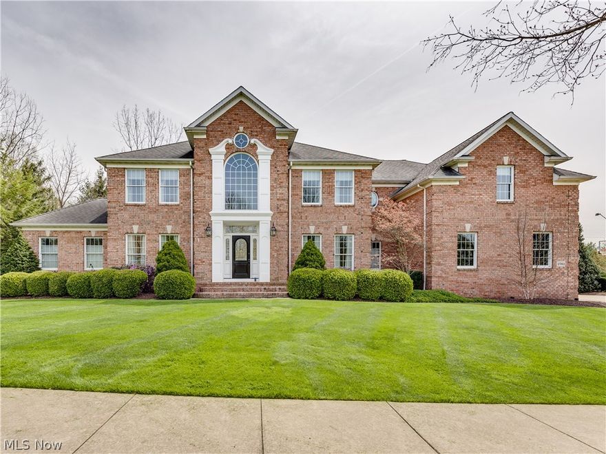 Impressive all brick custom-built 5 bedroom home sets on a nicely landscaped and well manicured lot. Beautiful wood trim and 6-panel doors. Grand foyer entrance looks through the house to the outdoors and has a 2nd floor balcony. The 2-story Great Room has a fireplace and a wall of windows. The kitchen offers a unique set-up which can be used as a Hearth Room or dinette.  The cabinets are top notch with 2 types of wood for interest and style. There are granite counter tops, an Island/Breakfast bar, a large pantry and stainless steel appliances. Two sets of doors lead to the brick patio/outdoor entertaining area. The master bedroom is spacious featuring a tray ceiling, ceiling fans, a bayed area ideal for a sofa & chairs. French doors lead to the patio area. The master bathroom has dual vanities, a jetted tub, glass shower and a closet with built-in shelves. There are 2 Half Bathrooms and a Laundry room on the 1st floor. Plus, there are 2 sets of stairways leading to the 2nd floor. The