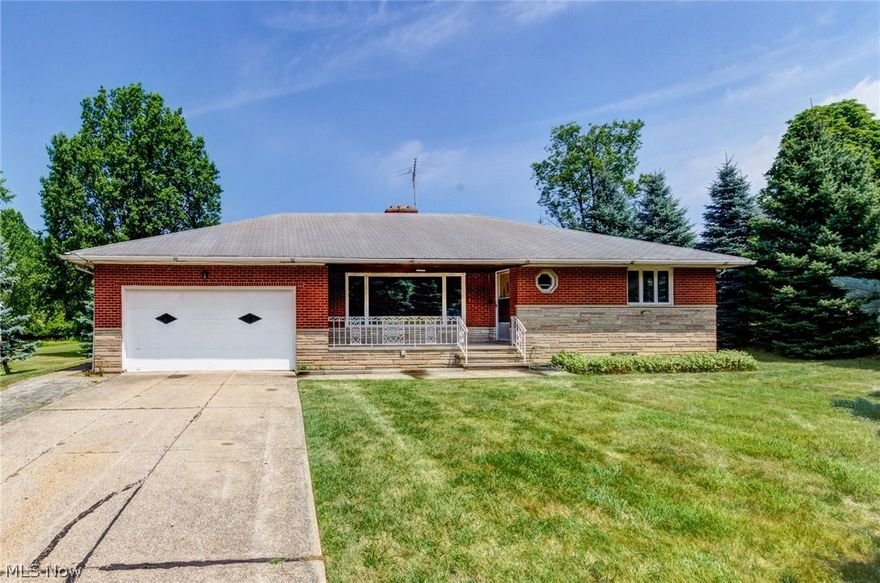 If you love a spacious brick ranch home with over an acre of land - close to everything, this home will steal your heart! Enjoy an open floorplan, spacious rooms, and gorgeous views from every window, and from the welcoming front porch! As you enter the living room you will immediately see the thoughtful design of this home. A woodburning fireplace in the living room is enhanced by a stone surround. The dining room adjoins, and also has sliding doors to the back porch and with a view of the back of this 1+ acre property. Three generous bedrooms have lots of closet space, and hardwood throughout the main floor. Family room with another fireplace in the lower level! A great space to relax... Owner kept bees and hives and used basement kitchen for beekeeping work. Two car attached garage. Recent waterproofing. This home is just waiting for you! See it today!