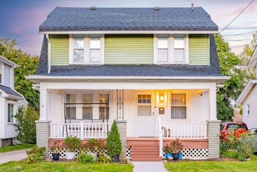 Welcome to 1274 Neptune Ave, a beautifully updated colonial in the heart of Akron's beloved Firestone Park neighborhood.  This warm home blends classic charm with modern upgrades that create a space that instantly feels inviting.  When you enter, you are welcomed by rich hardwood floors that flow seamlessly throughout the main home.  The living room offers a gas fireplace that sets the perfect tone for cozy gatherings.  The large dining room is perfect for family gatherings that are prepared in the custom updated kitchen.  The custom kitchen features newer appliances, custom cabinets that feature solid wood drawers and doors, built in spice racks, custom pot and pan storage, beautiful granite countertops, tile backsplash, and a large pantry area for plenty of kitchen storage.  The three bedrooms upstairs feature the same beautiful hardwood flooring.  The upstairs also features an updated full bathroom and a cedar closet.  The basement features a gas fireplace, a half bathroom, glass block windows, storage areas, and a laundry area.  The home features a newer roof, furnace, AC system, and a recently installed hot water heater.  With major mechanical updates already completed, this home offers peace of mind and lower maintenance living for years to come.  The detached two car garage has a newer garage door, automatic garage door opener, and electrical service.  It is a great place to either park your family cars or create a space to work on your automotive projects.  1274 Neptune is move-in ready and waiting for its next chapter.  Schedule your private showing today!