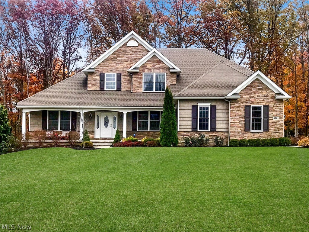 Welcome to this newer exquisite dream home, former model home with many high end upgrades located in wonderful Mountainside Farms. If you appreciate quality and attention to detail then this stunning dream home is a must see! As you come through the beautiful lead glass door you will enter into a two story open foyer & be prepared to be wowed. The large vaulted great room offers a gas fire place, and a wall of windows that bring abundance of sun-filled natural light. If its to bright the custom Hunter Douglas blinds will block the light. Gourmet eat-in-kitchen features, granite counters, stainless appliances, custom cabinetry, pantry, and hardwood flooring. Right off the kitchen is a large formal dining room that has a tray ceiling, wainscoting and ambient lighting that is a perfect place to host family gatherings. Enjoy the luxurious first floor vaulted master suite boasting a large custom walk-in-closet that is tastefully designed with all the right added features. Glamour bath comes