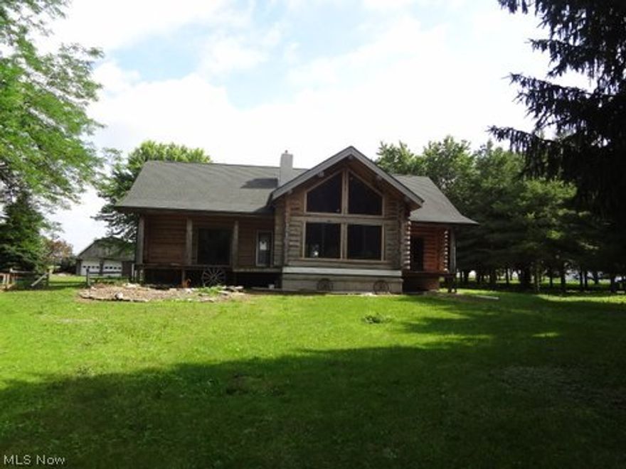 Design your dream.  All the pieces are in place.  One of a kind custom log home situated on 6.78 acre.  Open floor plan with first floor master.  Lower level walkout leads to wide open spaces.  There is room for all your toys.  Act now.