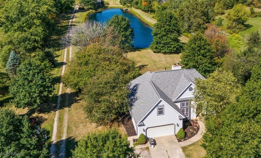 Welcome to the perfect sized country estate! This welcoming 3-bedroom, 2-bath home sits on 5 picturesque acres, offering the perfect blend of modern comfort and rural charm. As soon as you arrive, you'll feel the stress melt away as you take in the serene setting complete with a sparkling pond and secluded livestock areas. Step inside to discover an inviting open floor plan that's perfect for both everyday living and entertaining. The kitchen flows seamlessly into the dining and living areas, creating an airy, connected space filled with natural light. The master suite features a private deck overlooking the tranquil pond and rolling acres, it's the perfect spot to start the day with a cup of coffee or unwind in the evening as you watch the sunset paint the sky. The en-suite bathroom and generous closet space complete this private retreat. Two additional bedrooms provide comfortable space for family, guests, or a home office setup. The second full bathroom is conveniently located to serve both rooms and any visitors. Outside, hobby farm dreams come true with a well-built barn that can be outfitted for horses, goats or other livestock . The acreage offers plenty of space for gardening, outdoor activities, or future expansions, while still being manageable for maintenance. Don't miss this rare opportunity to own a slice of paradise that combines modern living with country charm. Your dream of a life surrounded by nature's beauty, with space for both family and horses, awaits right here.
